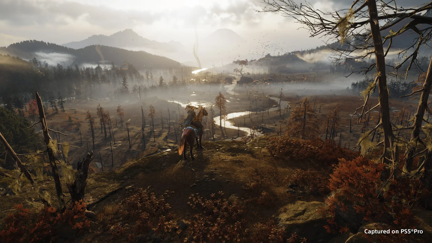 Atsu overlooking sunlit foothills