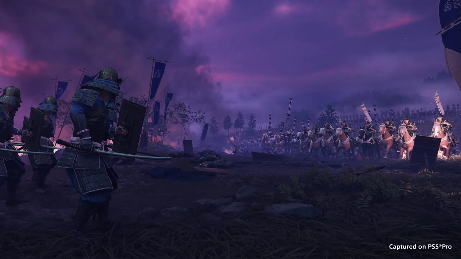 Warriors on a battlefield under a purple sky