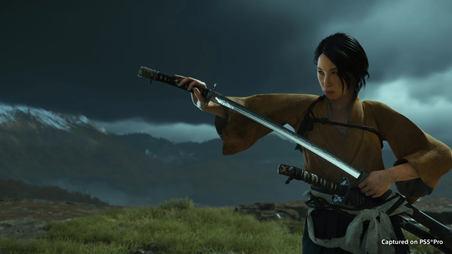 Atsu aiming a firearm beside her katana